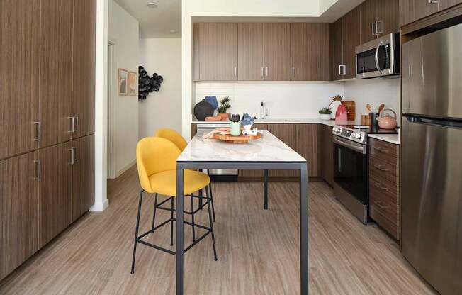 a kitchen with a table and chairs
