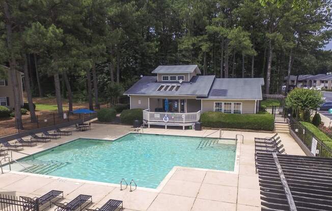 Swimming pool area at Harvard Place Apartment Homes by ICER, Lithonia, GA, 30058
