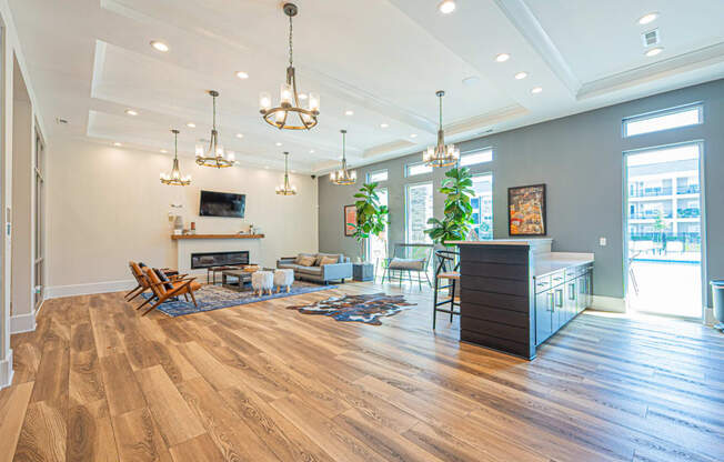 a living room with a fireplace and a table and chairs