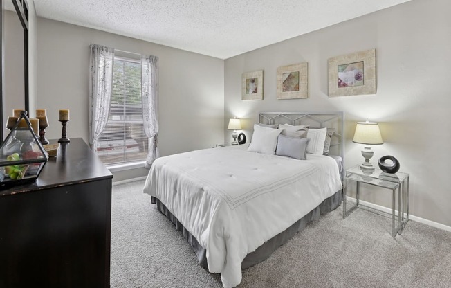 B1 second bedroom with white bed at Westdale Pointe in Austin, TX