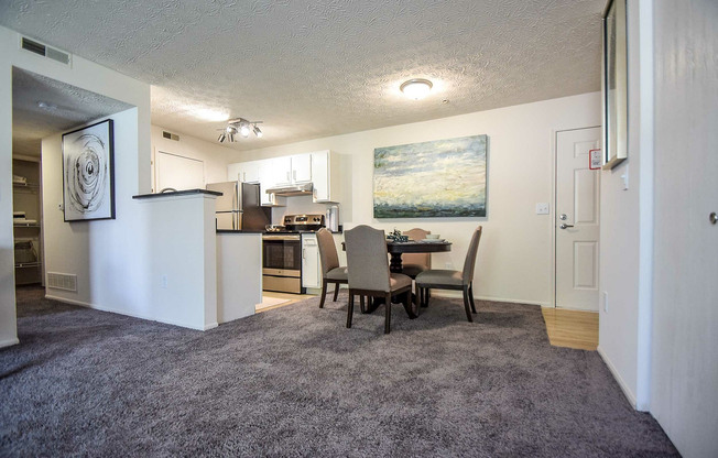 Experience the charm of this elegant living space with an open dining area and a stylish kitchen.