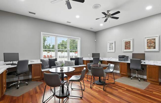 A modern office space with wooden floors and white walls.