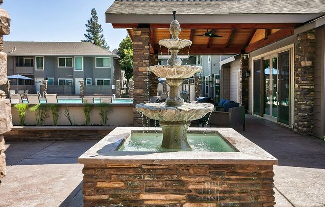 a fountain in front of a building