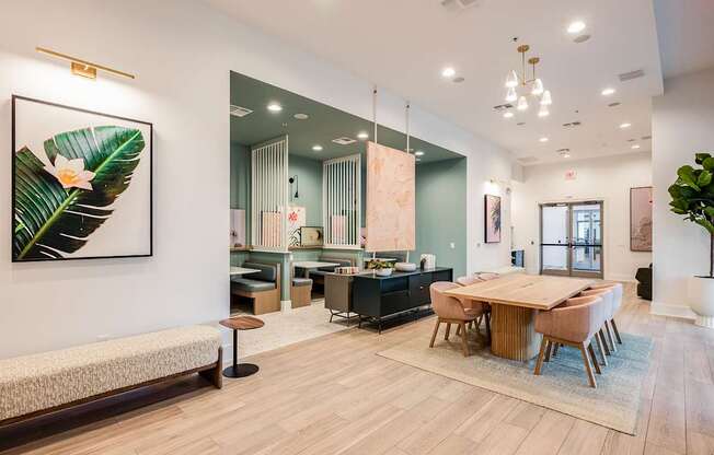 A living room with a dining table and chairs.