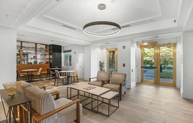 A living room with a striped chair and a coffee table.