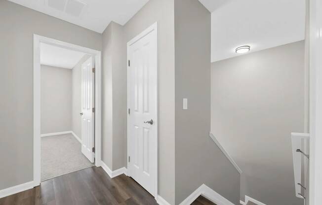 a renovated living room and hallway with a door to a closet at Traditions at Slate Ridge, Ohio