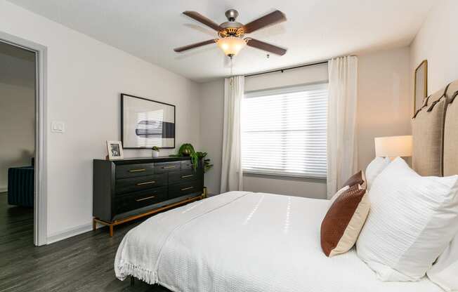 bedroom with large bed and ceiling fan at Briarcliff Apartments, Georgia, 30329
