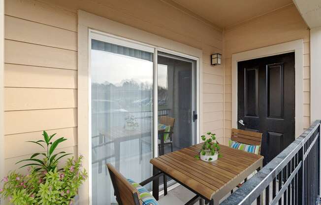 An enclosed private patio with a storage closet.