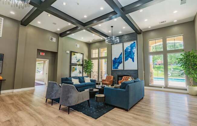 a living room with couches and chairs and a fireplace