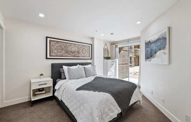 Bedroom with queen size bed, patio entrance