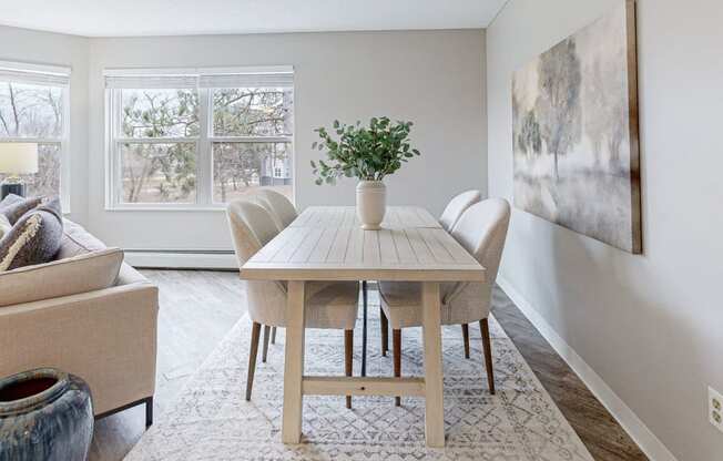 a dining room with a table and chairs