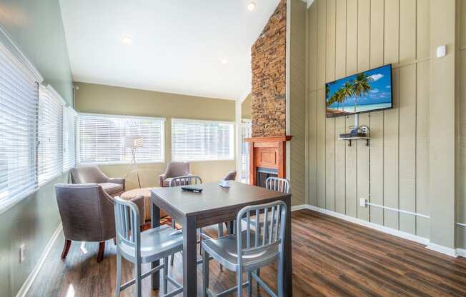 a dining room with a table and chairs and a fireplace