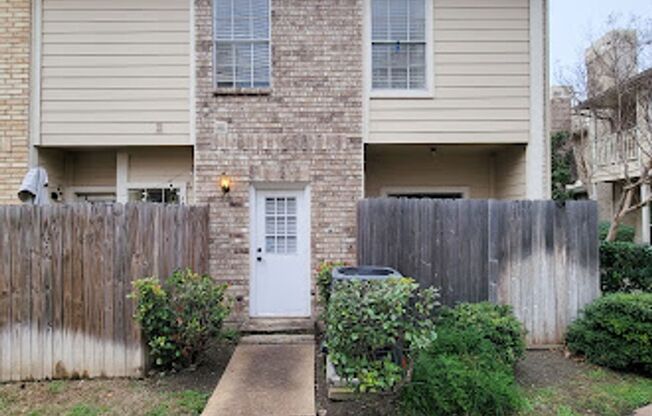 Beautiful two-story corner unit filled with natural light!