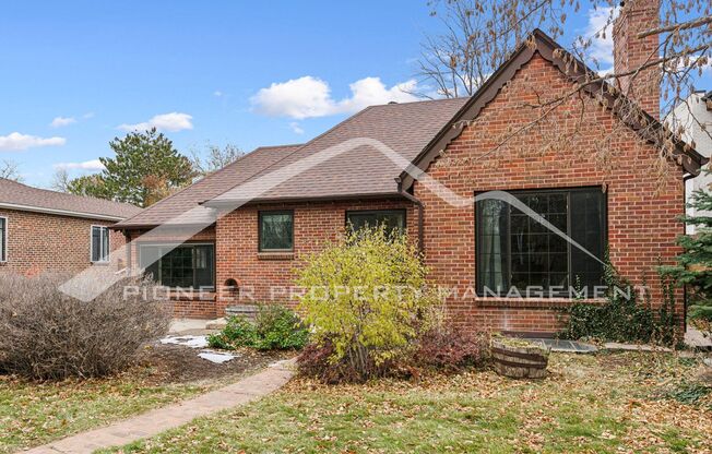 Attractive Brick Tudor With Large Yard In A Very Desirable University Hills Location!