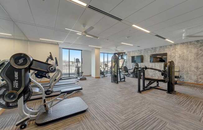 the gym is equipped with weights and other exercise equipment