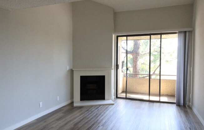 Spacious Living Room Flooring Throughout Fireplace & Balcony