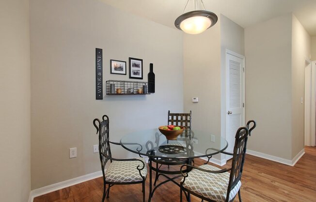 Dining room with overhead lighting and hardwood-inspired flooring (Signature Series)