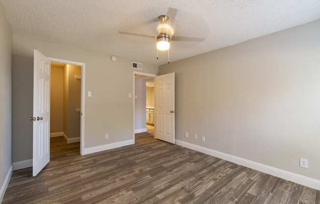 an empty living roomOf Vine apartment in Arlington, TX