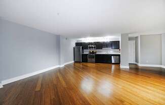 A kitchen with a wooden floor and spacious living room in Kalamazoo, MI