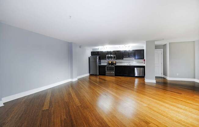 A kitchen with a wooden floor and spacious living room in Kalamazoo, MI