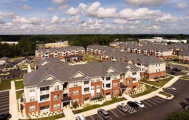 Aerial view of apartment buildings and parking lot