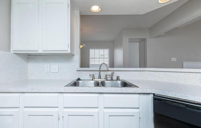 a kitchen with a sink and a window