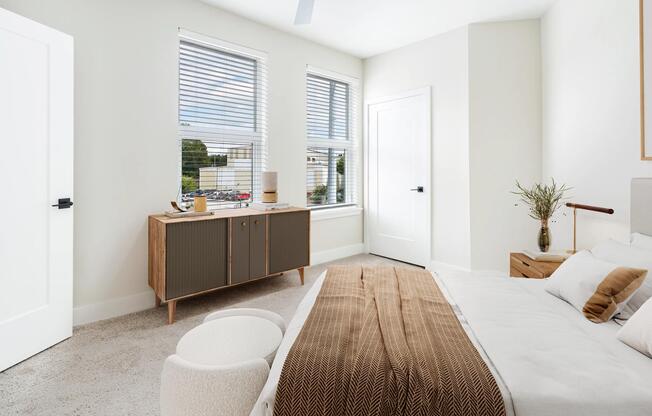 Light-filled bedrooms at Modera Westside Trail offer a calming retreat with clean lines and a spacious, inviting layout.