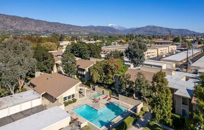 a aerial view of a pool and buildings in a city at Alosta Place, California, 91702