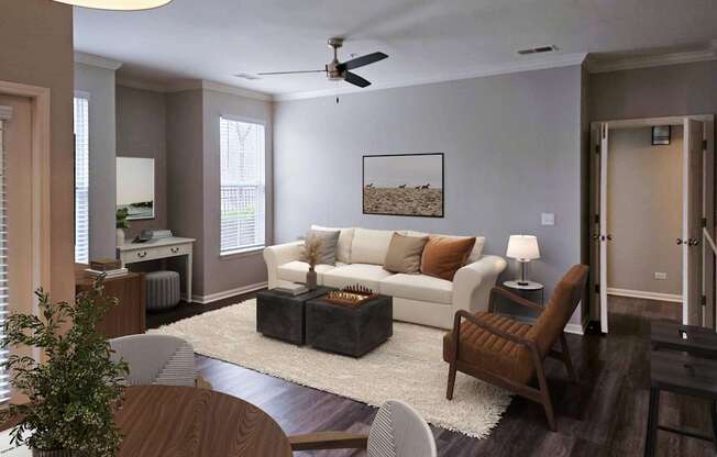 A living room with a white couch and a coffee table.