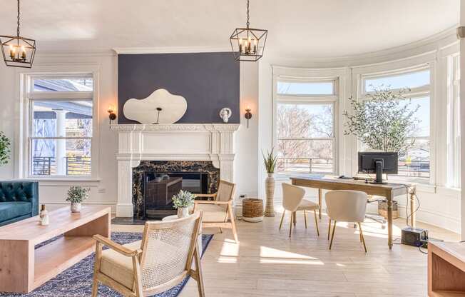 a living room with a fireplace and a large window