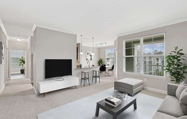 A modern living room with a flat screen TV and a fireplace.