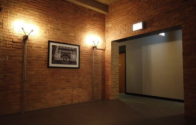 Exposed bring walls in the common area hallwaysat Carriage House Lofts, Chicago, Illinois