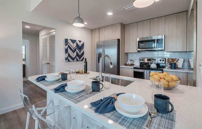 a kitchen with a counter top and a sink at Altis Santa Barbara, Florida