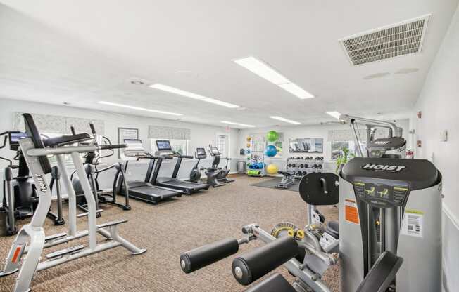 a view of our gym with various machines and weights