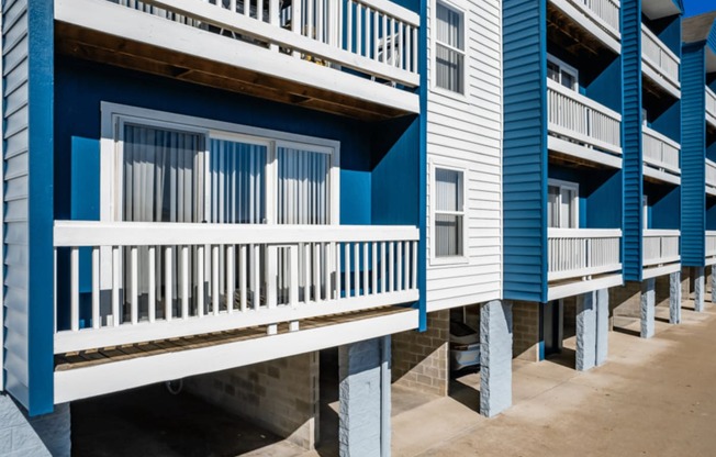 a row of blue and white rental houses