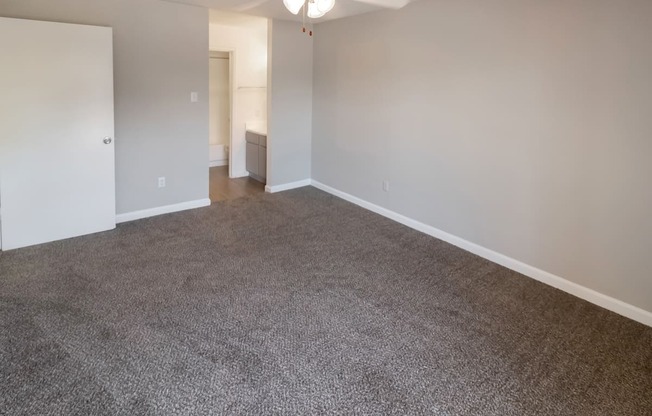 a carpeted bedroom in a Kirkwood Landing apartment home