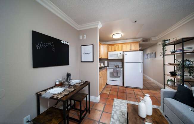 Living view of open kitchen in model apartment at the Atrium Apartments in San Diego, California.