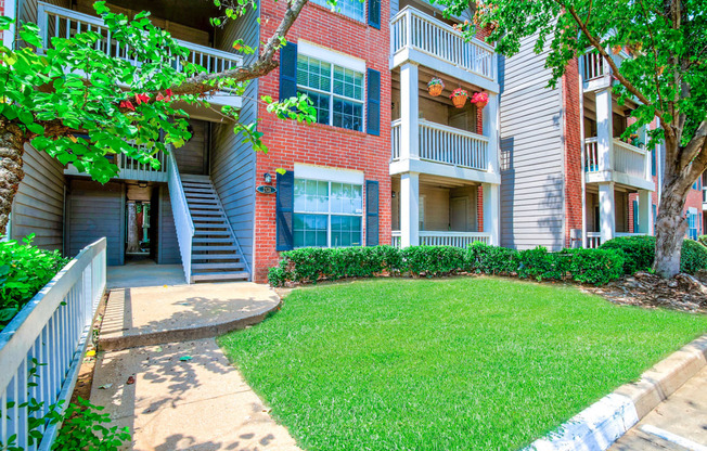 Community is filled with lush landscaping and mature trees at Greenbriar Apartments in Tulsa, OK!