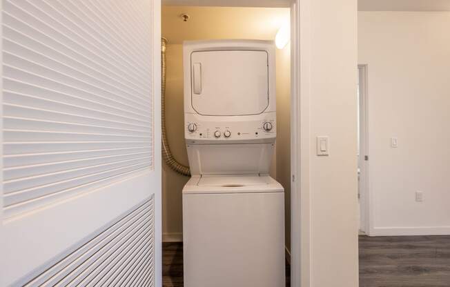 a laundry room with a washer and dryer in a closet