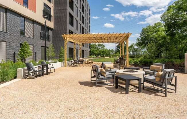 an outdoor patio with a firepit and a pergola at Hydro, Richmond, 23224