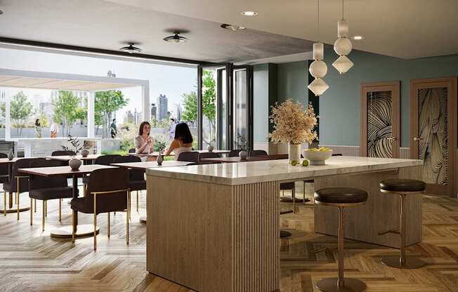 A woman is sitting at a table in a modern kitchen.