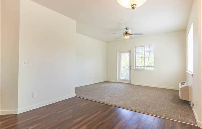 A room with a ceiling fan and a rug on the floor at Riverplace Apartment Homes, Oregon, 97351