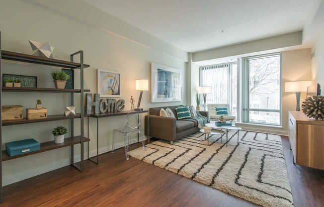 Asteria Living Room with Hard Surface Flooring and Floor-to-Ceiling Windows