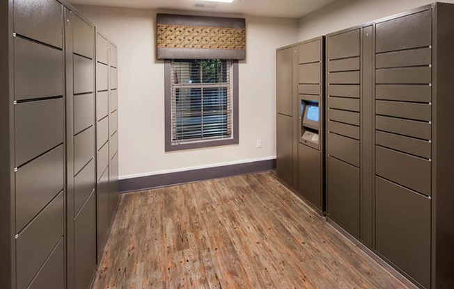 a room with a row of lockers and a window