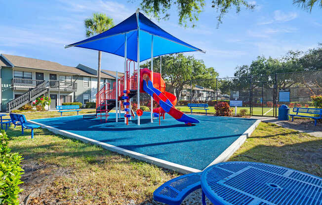 Community playground and seating area at Seven Lakes at Carrollwood in Tampa, Florida.
