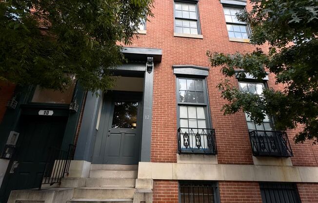 For Rent: Historic Charm at 12 E Madison St – Your Urban Sanctuary Awaits!