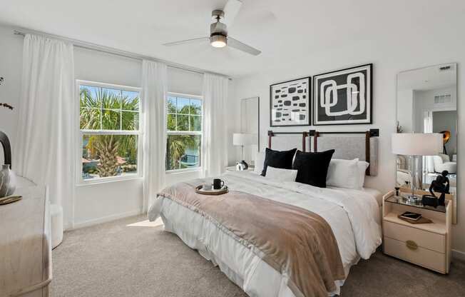 a bedroom with a bed and a ceiling fan at Altis Grand Suncoast, Land O' Lakes, 34638