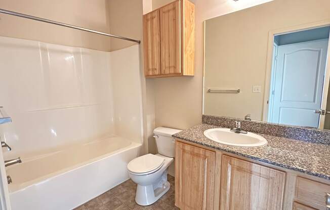 Liberty Bend Townhome Apartments, Sandy, Utah bathroom with a sink toilet and bath tub