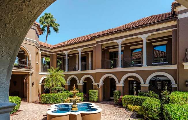 Arched walkways and landscaped courtyard featuring the iconic Magnolia Carillon fountain.