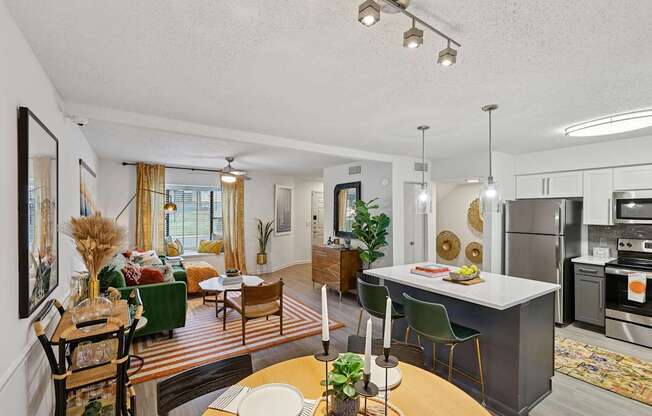 A modern kitchen with a dining table and chairs.